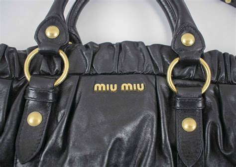 Leather handbag Miu Miu Black in Leather .